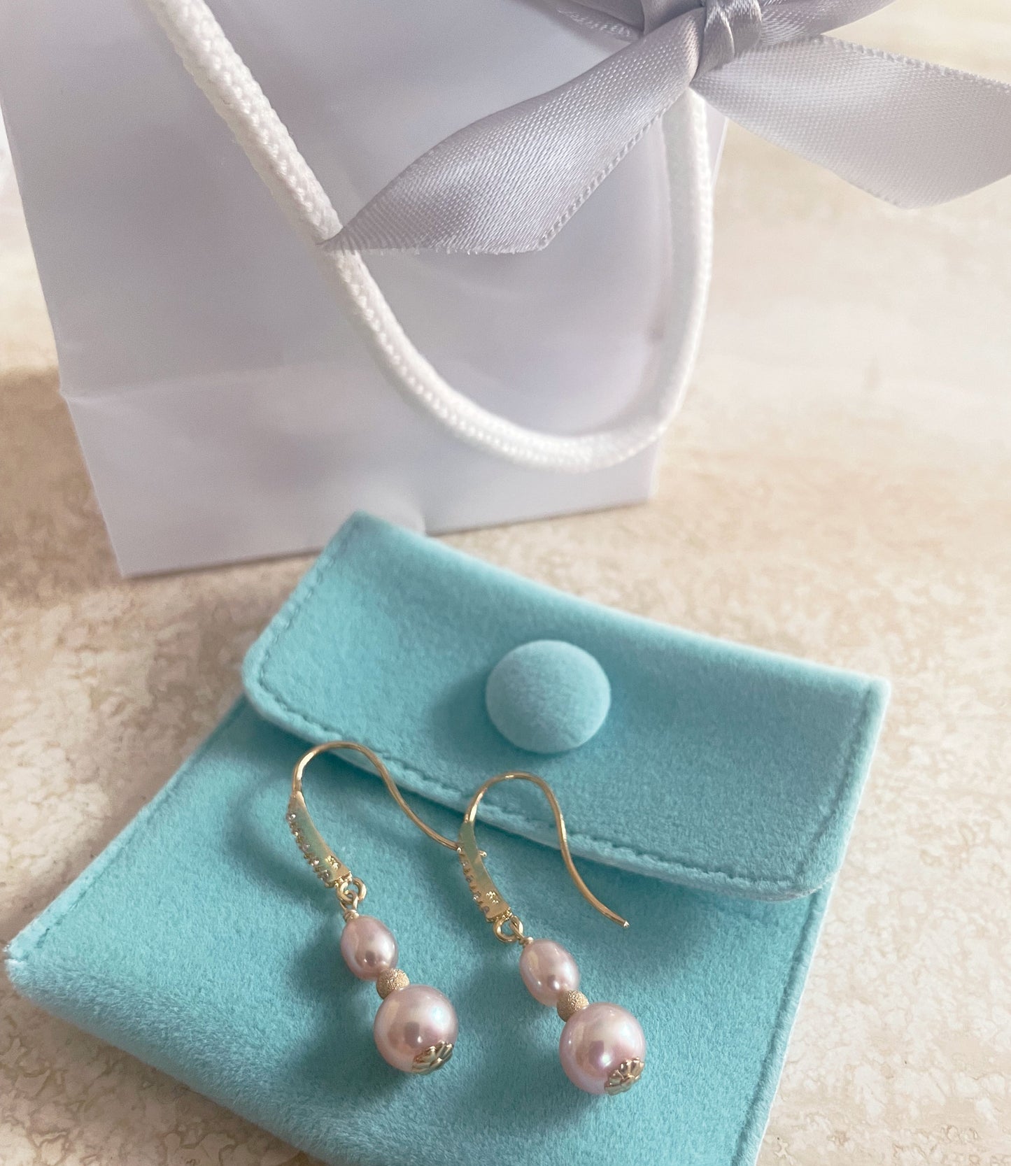 Long dangling pearl earrings for a fashion accessory. Real pearl jewelry designed and created by Jewelry Olga Montreal Canada