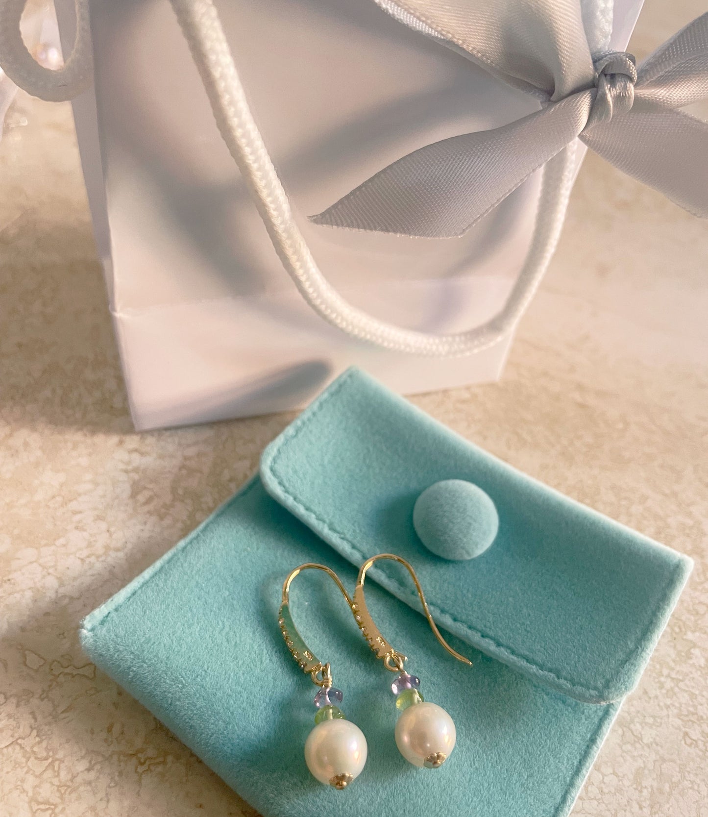 Long white pearl earrings for elegant contemporary women.