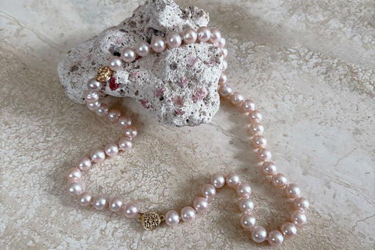 Modern pearl necklace features lustrous freshwater pink pearls.  Contemporary pink pearl jewelry for everyday wear.  Or, a perfect anniversary jewelry gift for her.  Designed and created by Jewelry Olga Montreal Canada