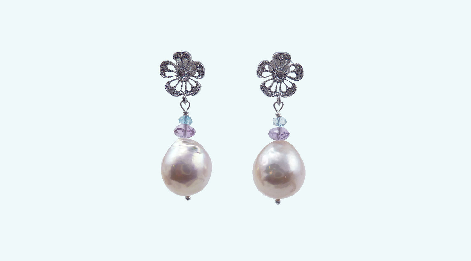 Contemporary baroque pearl earrings feature beautiful unique Chinese Kasumi pearls.  Modern dangling pearl earrings