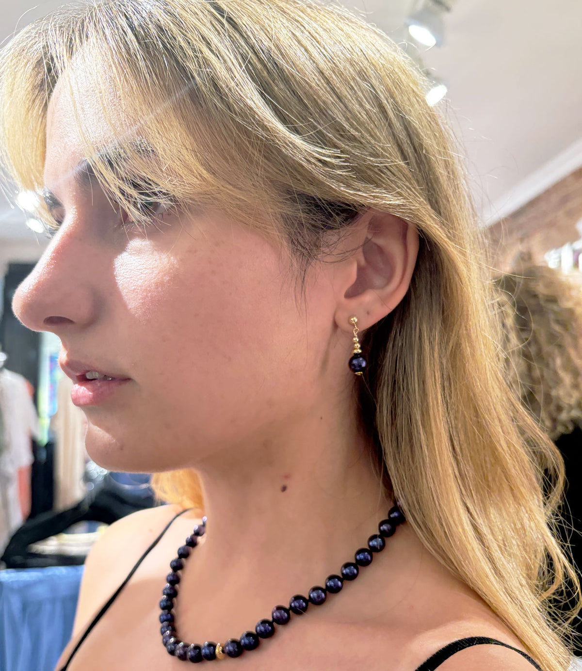 Stylish pearl necklace features real black pearls.   Contemporary black pearl jewelry adds drama and finishes the look.