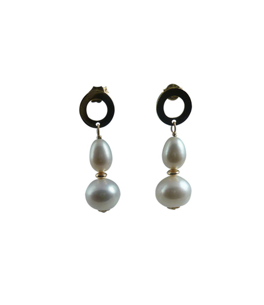 Modern white pearl jewelry for fashion-forward contemporary women.  Elegant white pearl earrings is a must.  Moreover, these dangling pearl earrings are a perfect jewelry gift for her - it may be an anniversary gift.