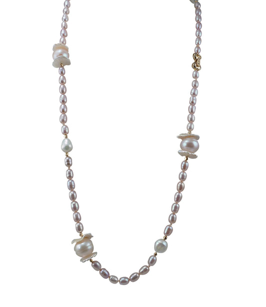 Contemporary pink pearl necklace  featuring freshwater pink pearls