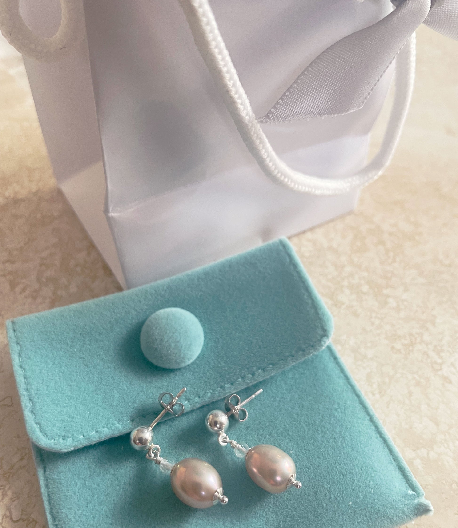 Dainty dangling contemporary pearl earrings are great fashion accessory for everyday wear.  Stylish custom pearl jewelry