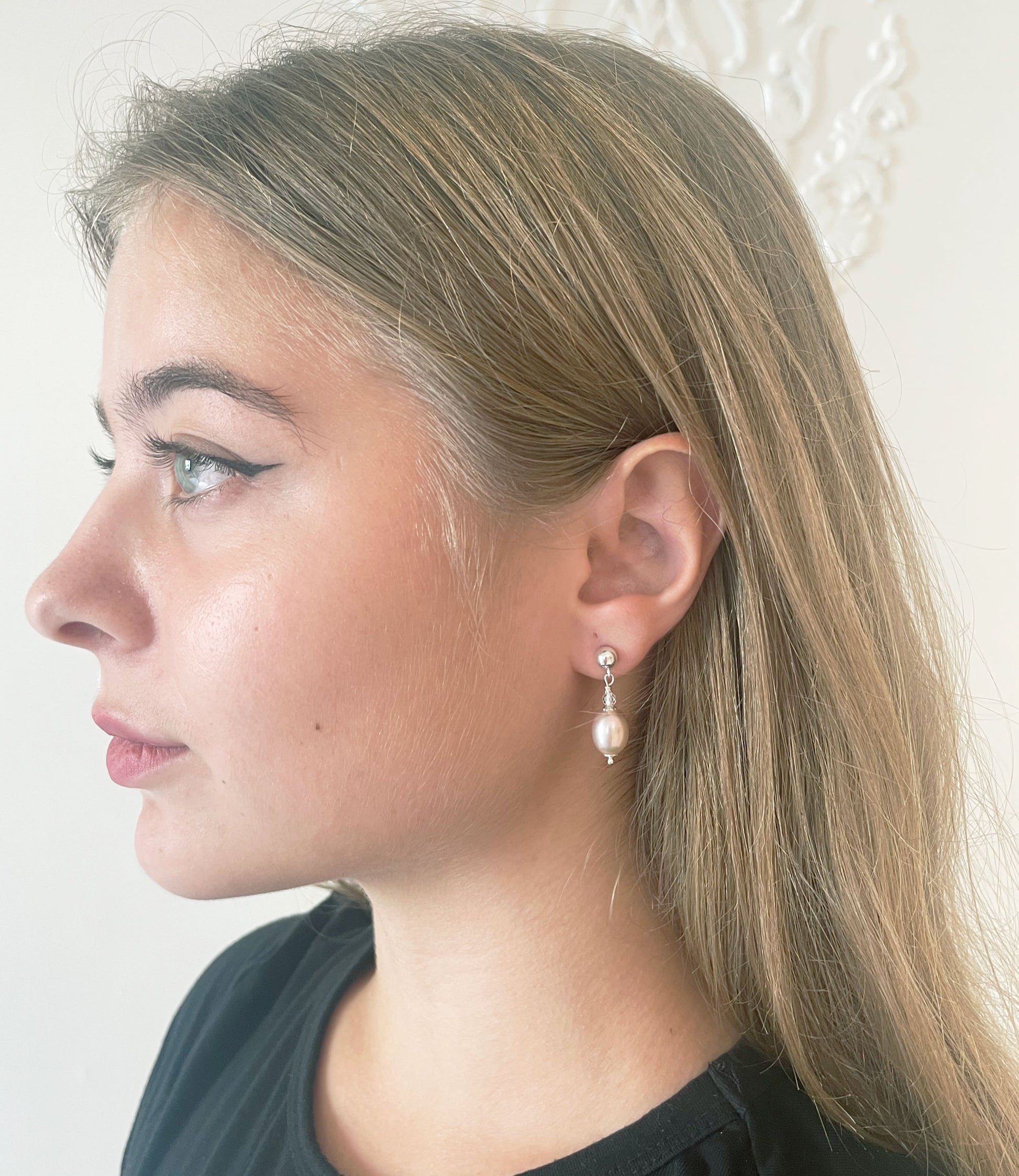 Dainty dangling contemporary pearl earrings are wonderful fashion accessory for modern women