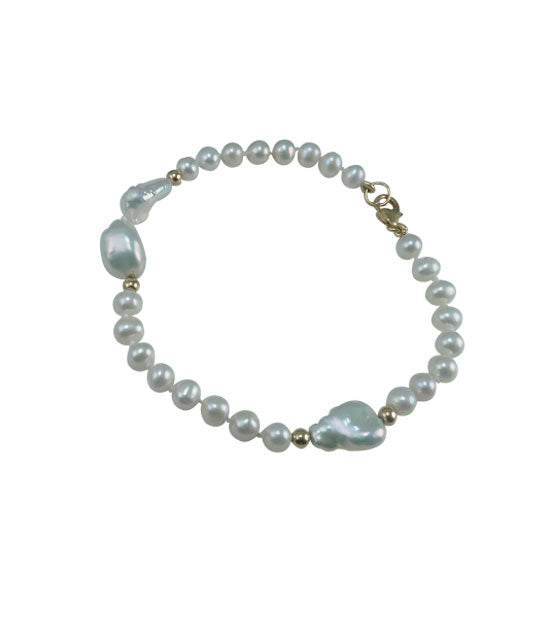 Dainty white pearl bracelet featuring freshwater pearls.  Stylish contemporary pearl jewelry for fashion-forward women.