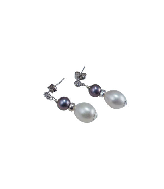Dangling white and black pearl earrings feature freshwater pearls.