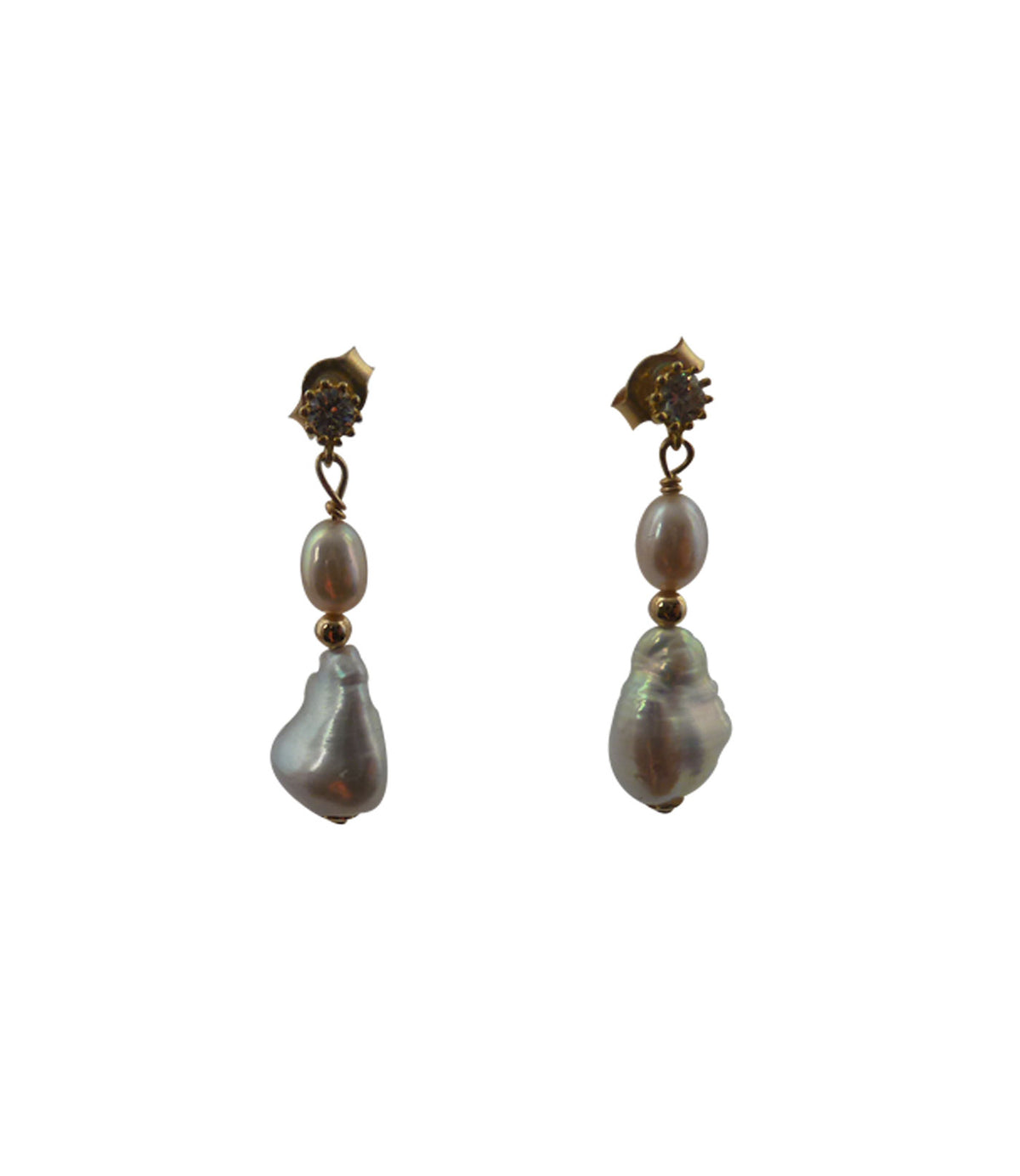 Modern pearl earrings featuring freshwater keshi pearls.  Baroque pearl jewelry is a big trend