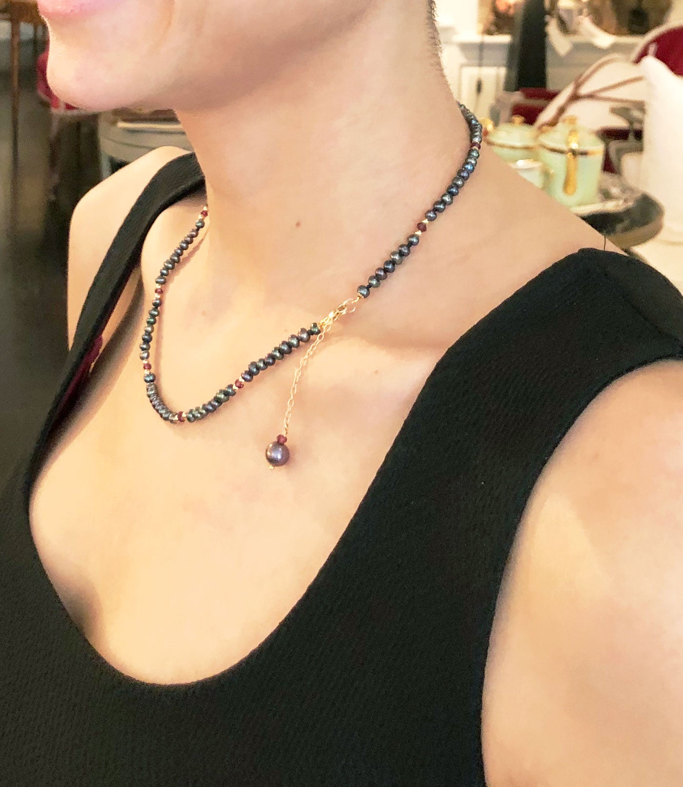 Delicate black pearl necklace with garnet.  Contemporary custom black pearl jewelry.  