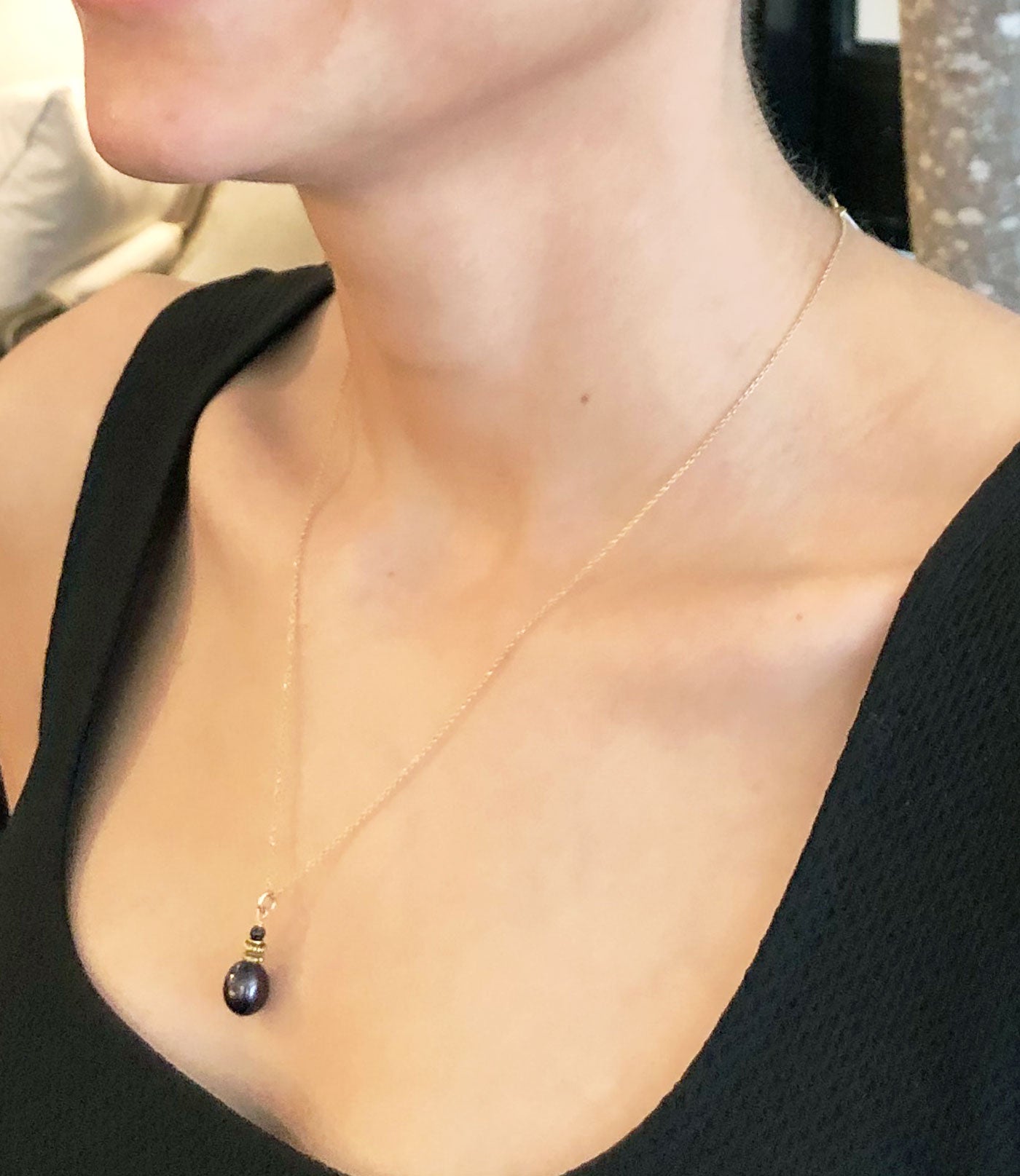 Delicate black pearl pendant necklace will finish your look.  Black pearl jewelry always adds drama