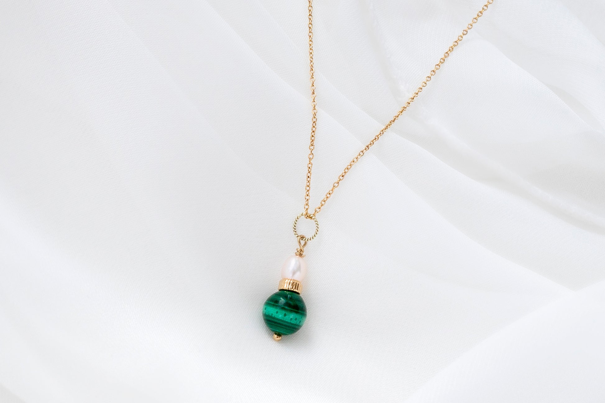 Delicate malachite and pearl pendant is a beautfiful fashion accessory for fashion-forward women