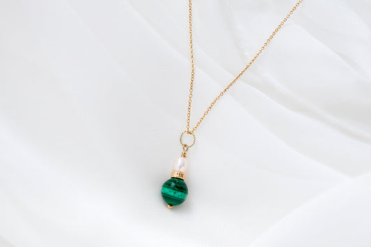 Delicate malachite and pearl pendant is a beautfiful fashion accessory for fashion-forward women