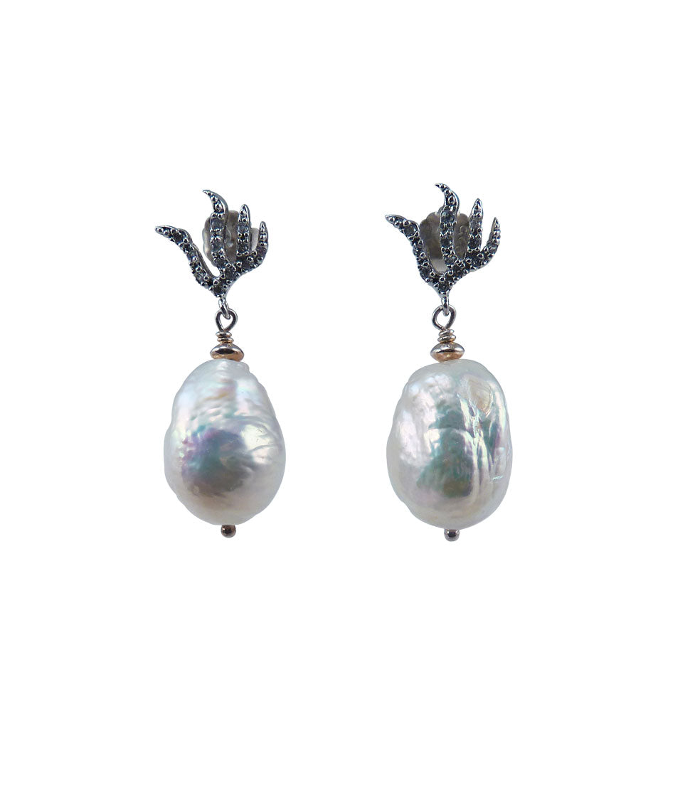 Elegant baroque pearl earrings featuring freshwater white baroque pearls.
