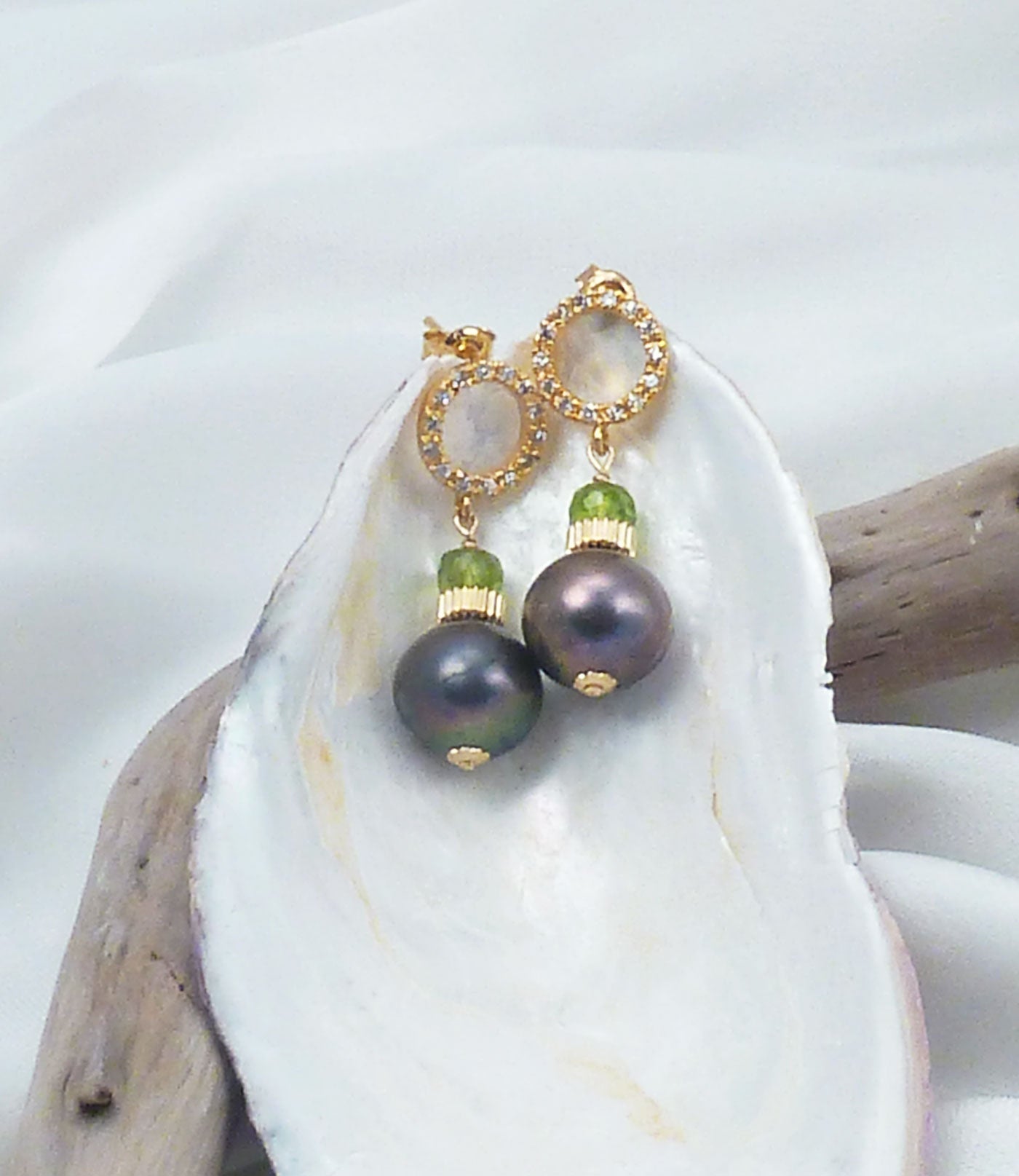 Elegant black pearl earrings with peridot featuring freshwater "black" pearls paired with green peridot.  Stylish black pearl jewelry for fashion-forward women.  