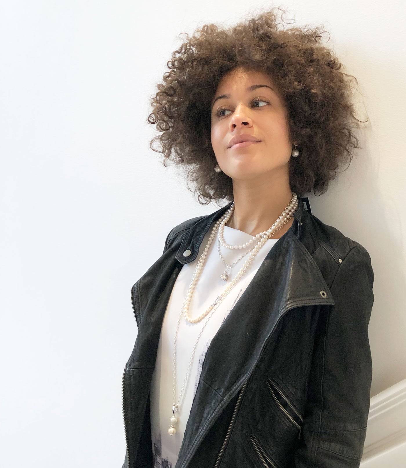 Elegant long white pearl necklace may be worn alone or layered with other pearl necklaces