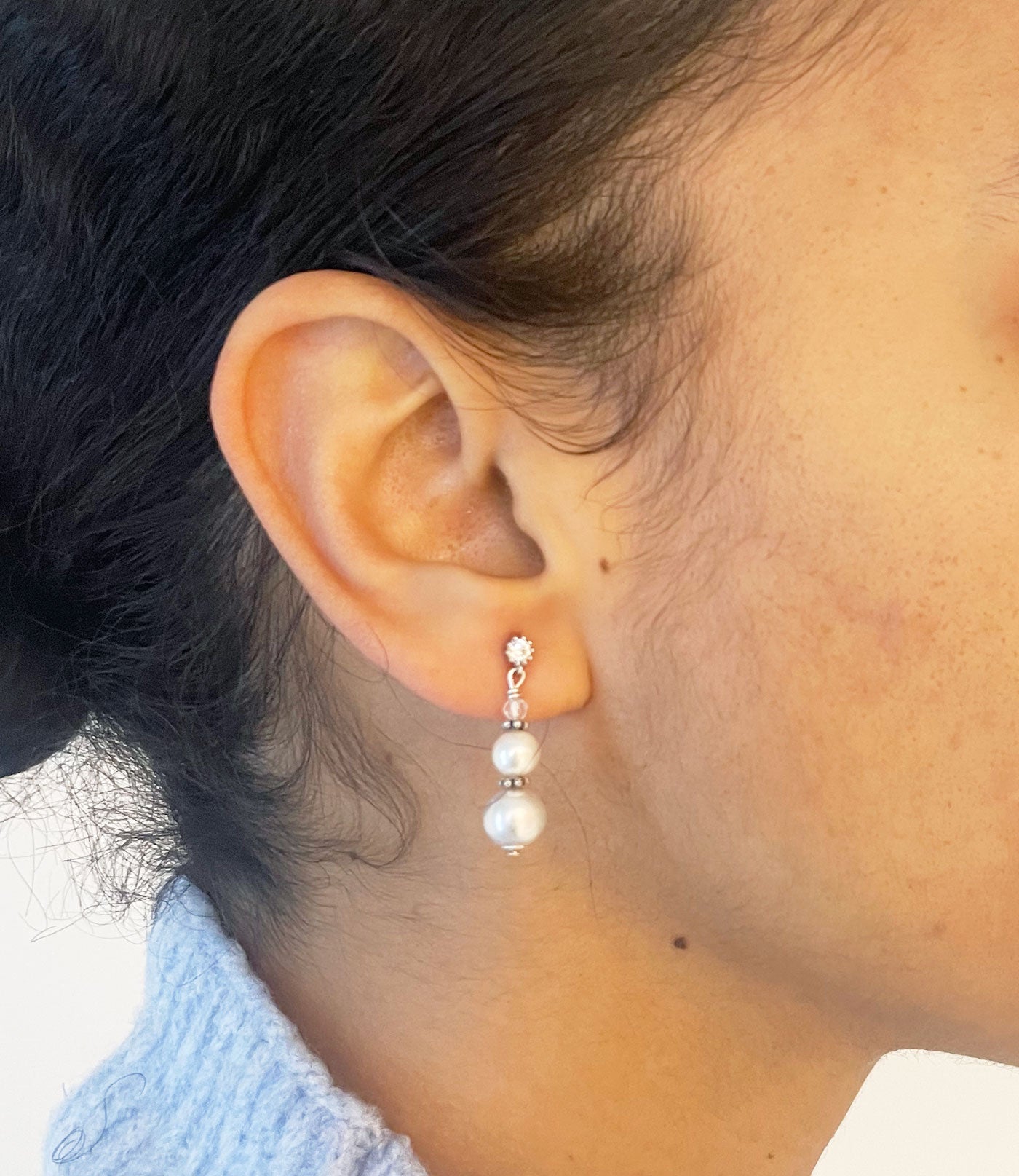 Elegant white pearl earrings may be worn on any occasion