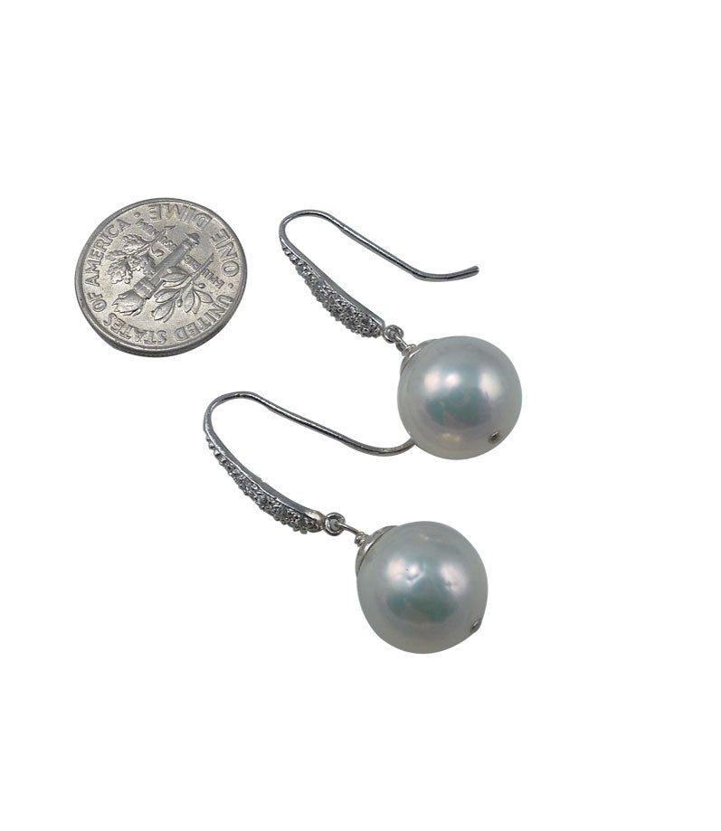 Elegant white pearl earrings featuring highly lustrous freshwater Chinese Kasumi pearls.  Dangling pearl earrings