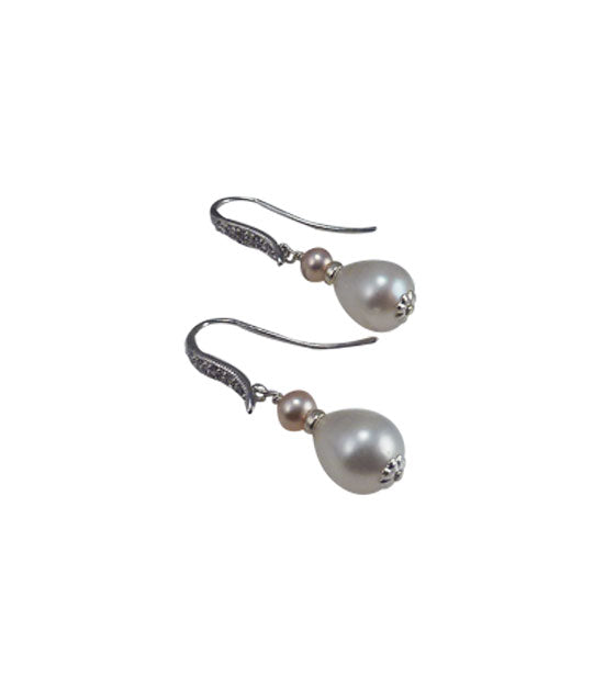 Everyday dangling pearl earrings feature white and pink freshwater real pearls.  Modern pearl jewelry for fashion-forward women