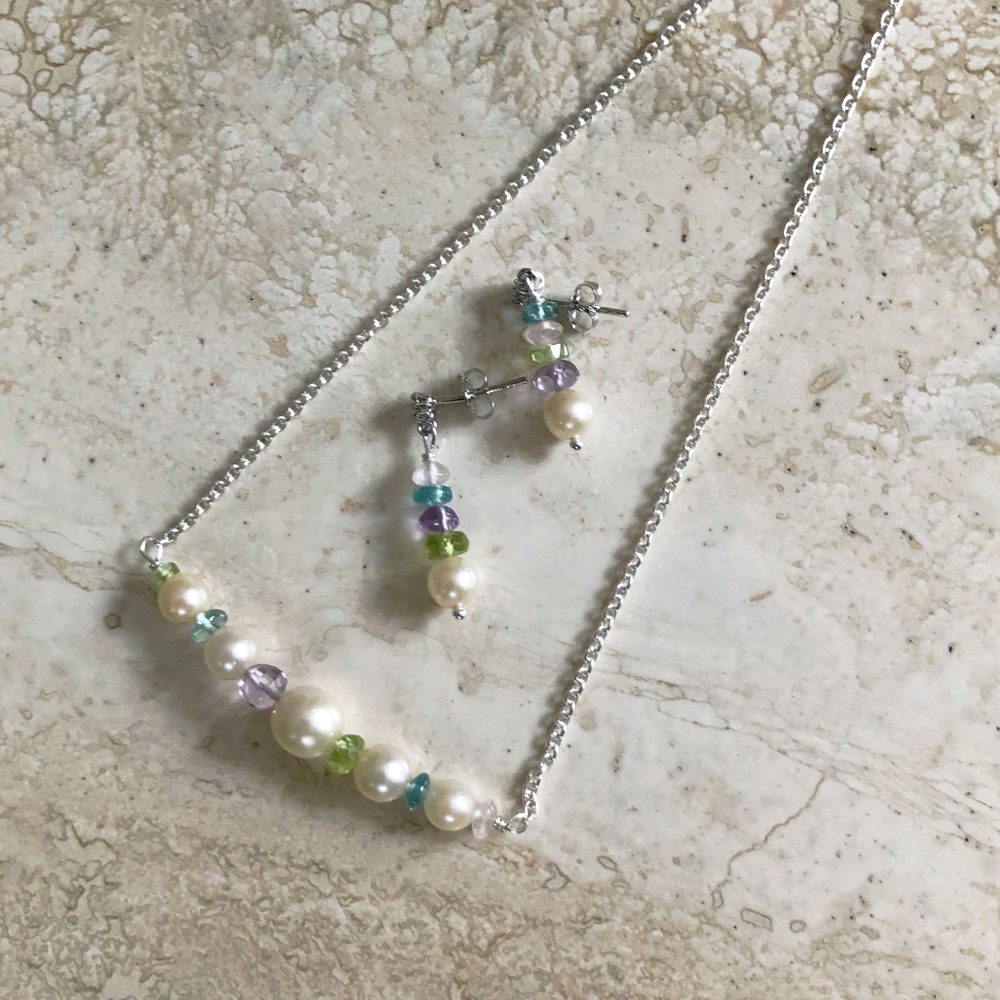 Fancy chain pearl necklace.  Modern white pearl jewelry featuring freshwater pearls and colored gems.  Contemporary pearl jewelry for fashion-forward women