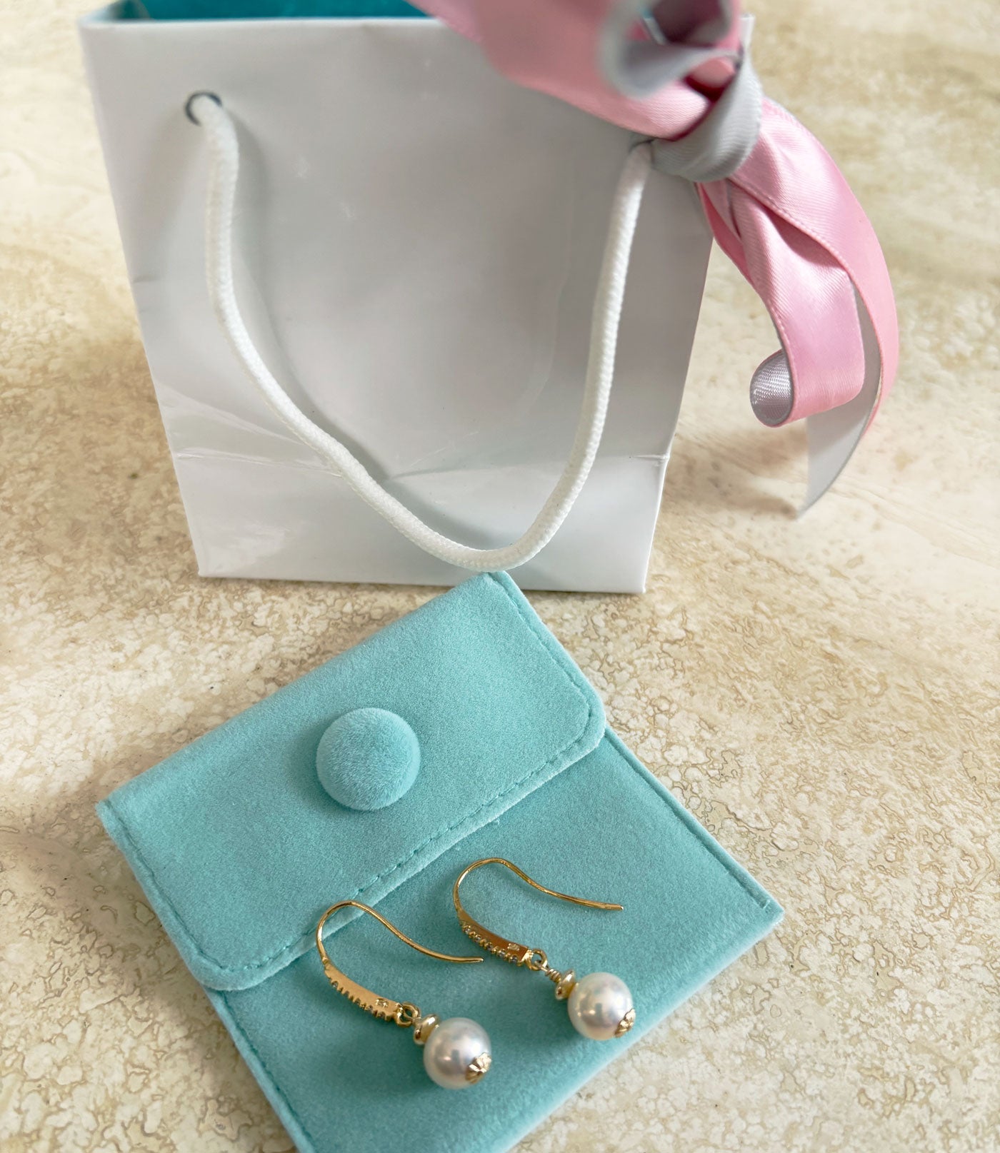 Golden dangling pearl earrings is a great jewelry gift for any occasion - a wonderful holiday jewelry giftt.