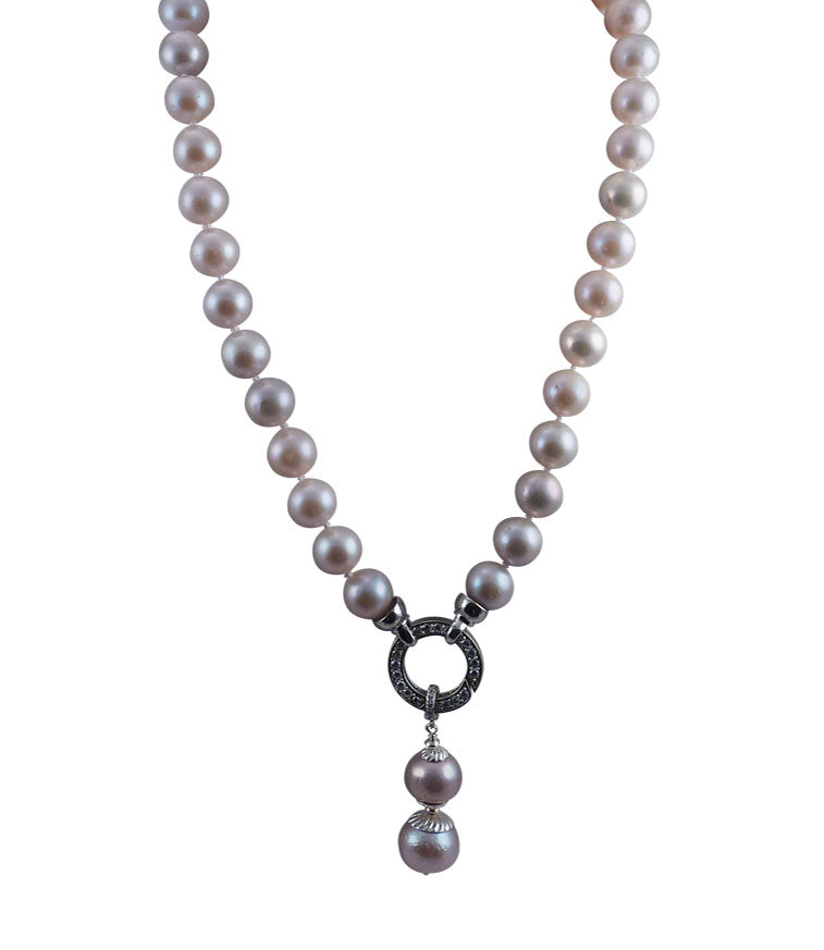 Gorgeous pink pearl necklace with detachable pearl pendant features rare large freshwater pink pearls.  Contemporary pearl jewelry