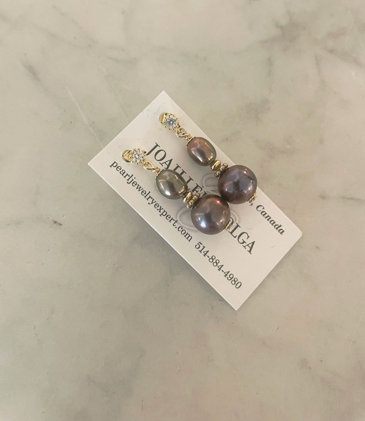 Graceful black pearl earrings in golden Vermeil setting.  This contemporary pearl jewelry will finish your look