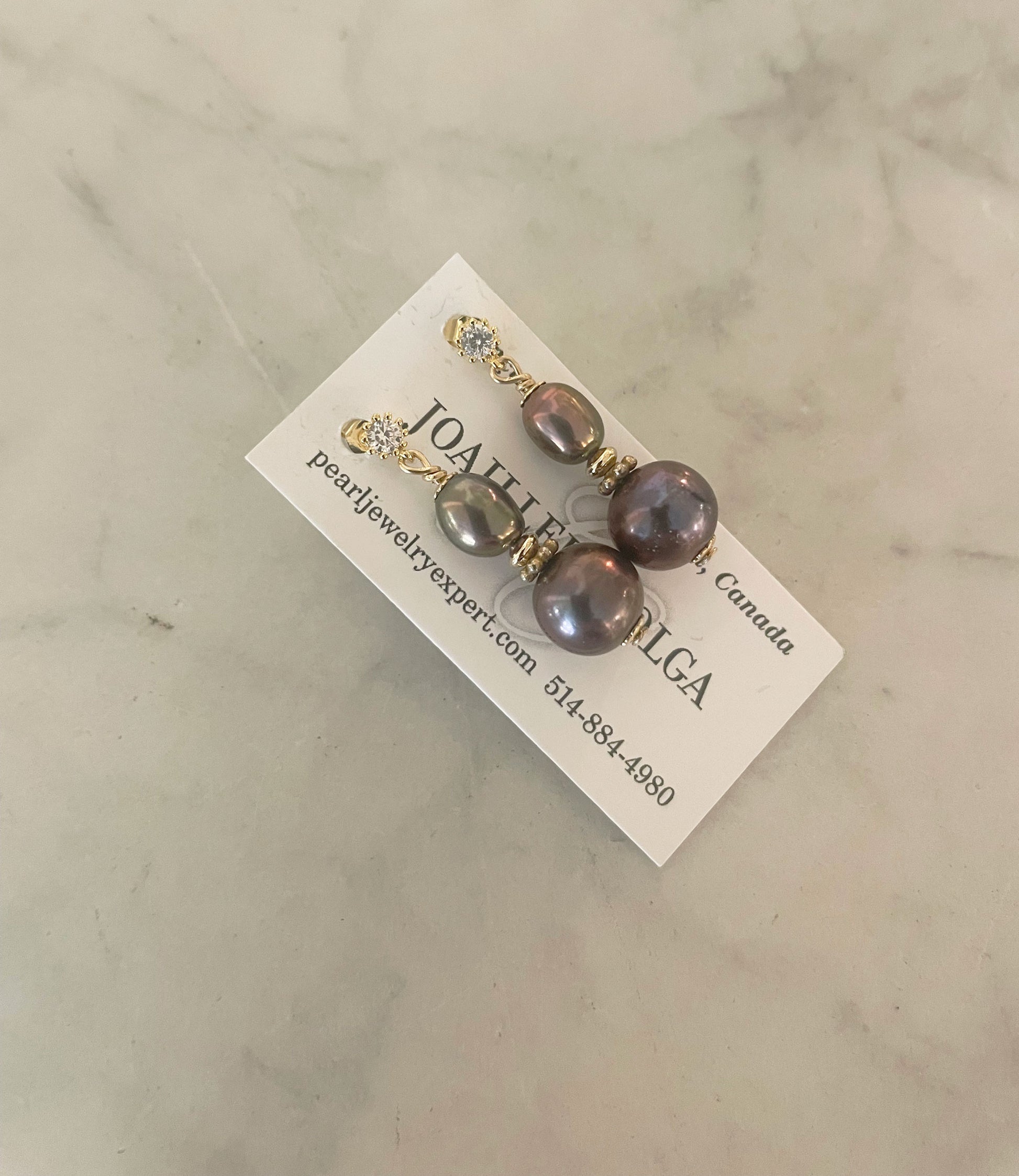 Graceful black pearl earrings in golden Vermeil setting.  This contemporary pearl jewelry will finish your look