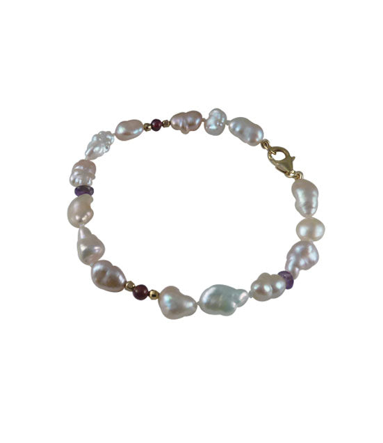 Keshi pearl bracelet with amethyst and garnet.  Contemporary pearl jewelry may be worn alone or stacked with other pearl bracelets.  Perfect pearl jewelry gift for various occasions