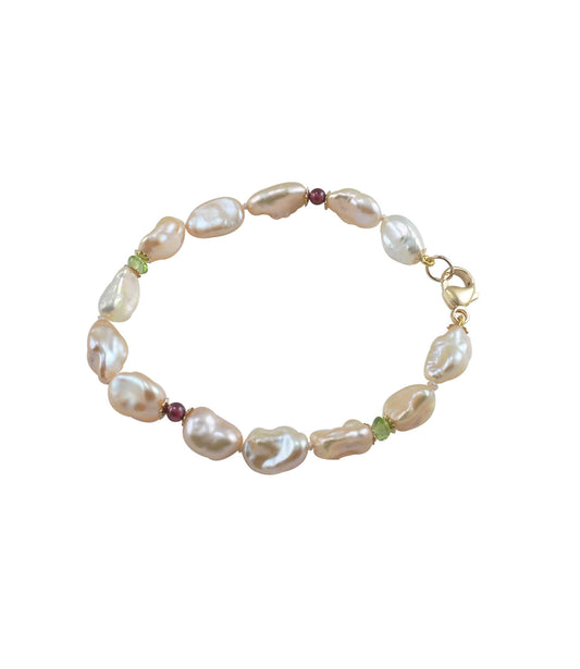 Keshi pearl bracelet with peridot and garnet featuring cultured freshwater keshi pearls.  Custom pearl jewelry