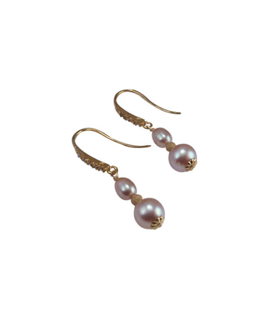 Long dangling pearl earrings to finish  your look.  Real pearl jewelry designed and created by Jewelry Olga Montreal Canada