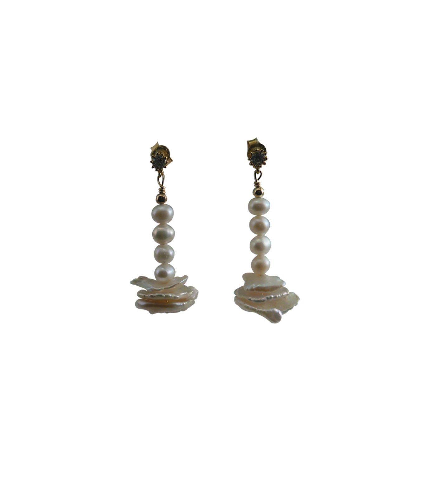 Dangling white pearl earrings featuring freshwater pearls including keshi pearls.  This modern pearl jewelry are great for casual wear or for a birthday gift. 