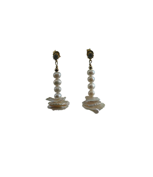 Dangling white pearl earrings featuring freshwater pearls including keshi pearls.  This modern pearl jewelry are great for casual wear or for a birthday gift. 