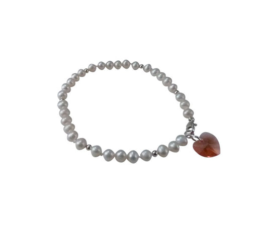Love small white pearl bracelet featuring freshwater pearls and red heart Swarvski crystals