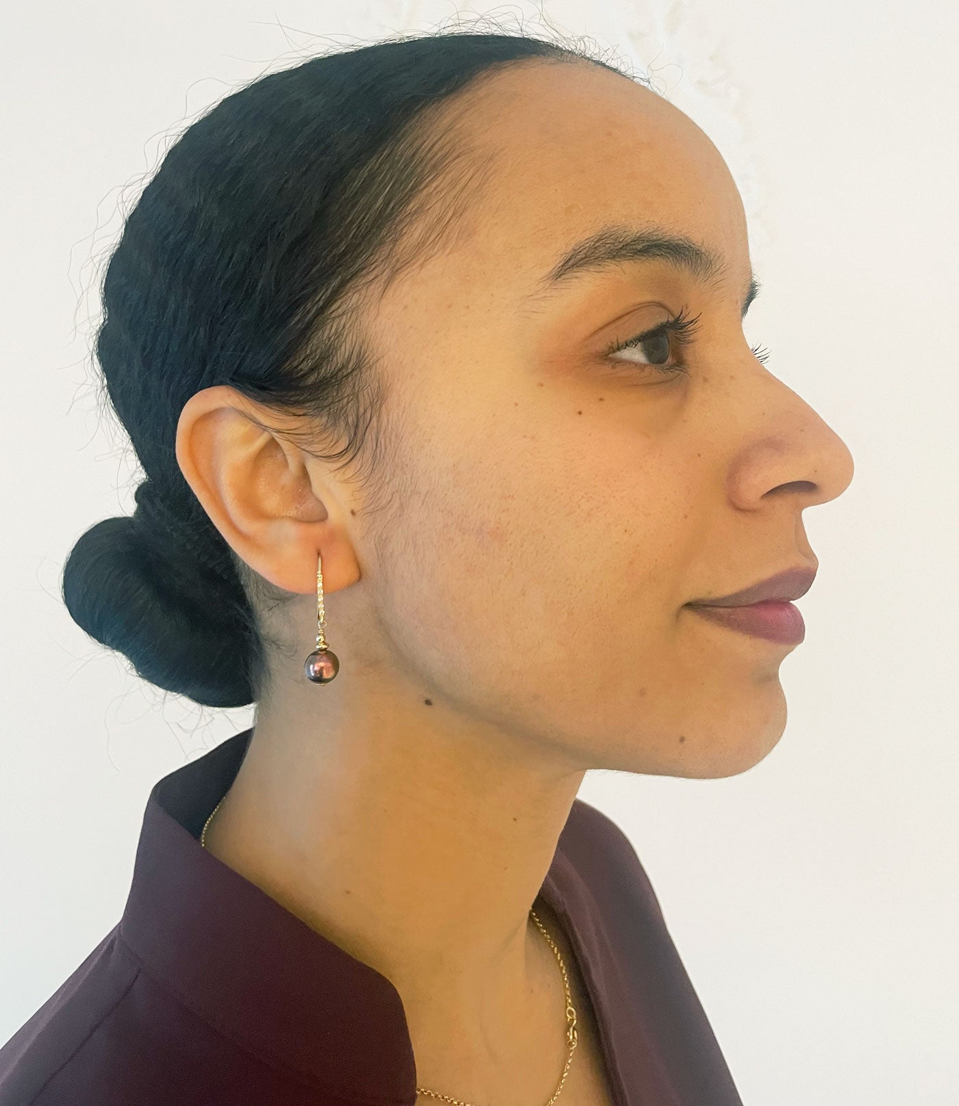 Lovely black pearl earrings will finish your look.  Dangling black pearl earrings look great