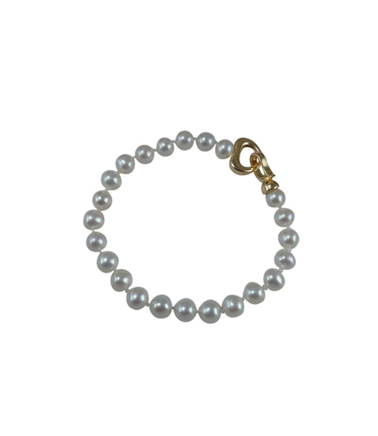 Minimalist white pearl bracelet features freshwater pearls.  Contemporary white pearl jewelry for fashion-forward women
