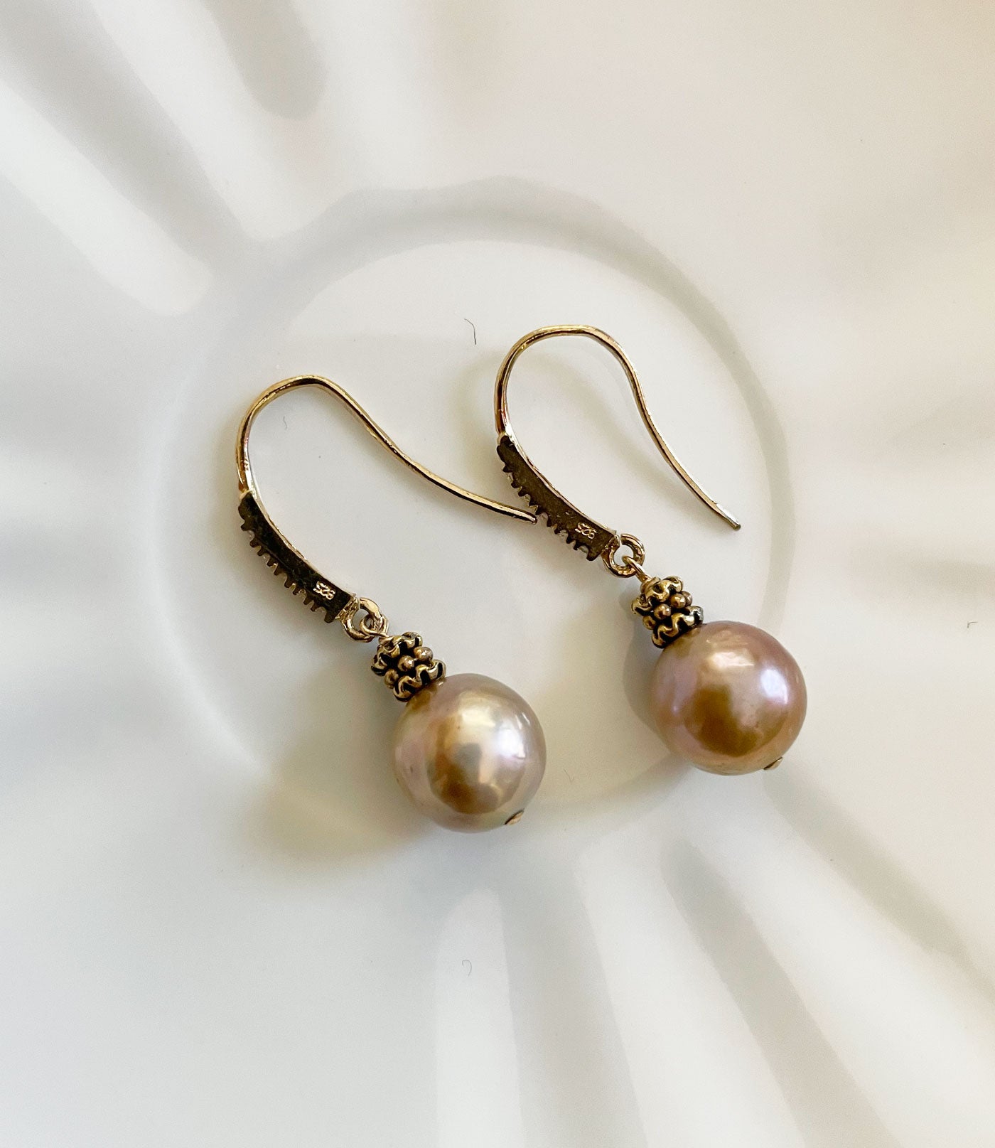 Modern bronze pearl earrings featuring lustrous freshwater pearls.  Contemporary pearl earrings for fashion-forward wear