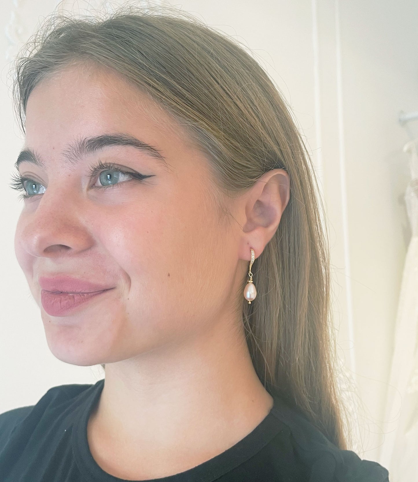 Dangling pink pearl earrings feature highly lustrous freshwater pearls in golden setting.  Great fashion accessory for stylish contemporary women