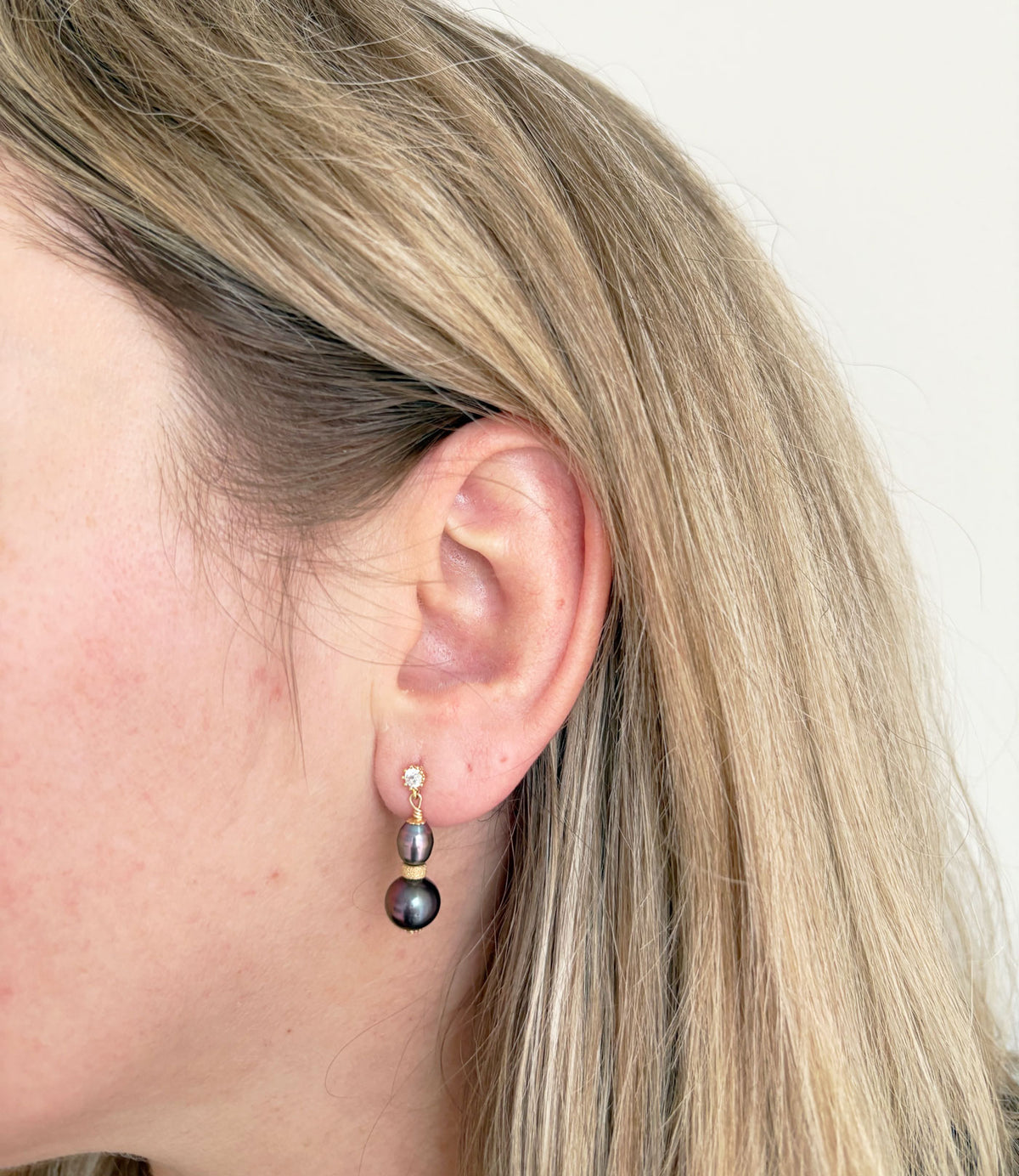 Contemporary black pearl jewelry.  Dangling pearl earrings featuring freshwater black pearls will finish your look.