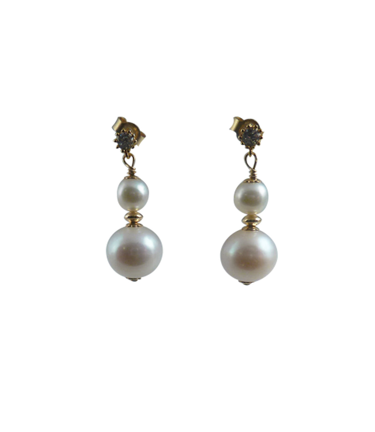 Elegant white pearl earrings.  Modern stud pearl earrings are one of the favorites.