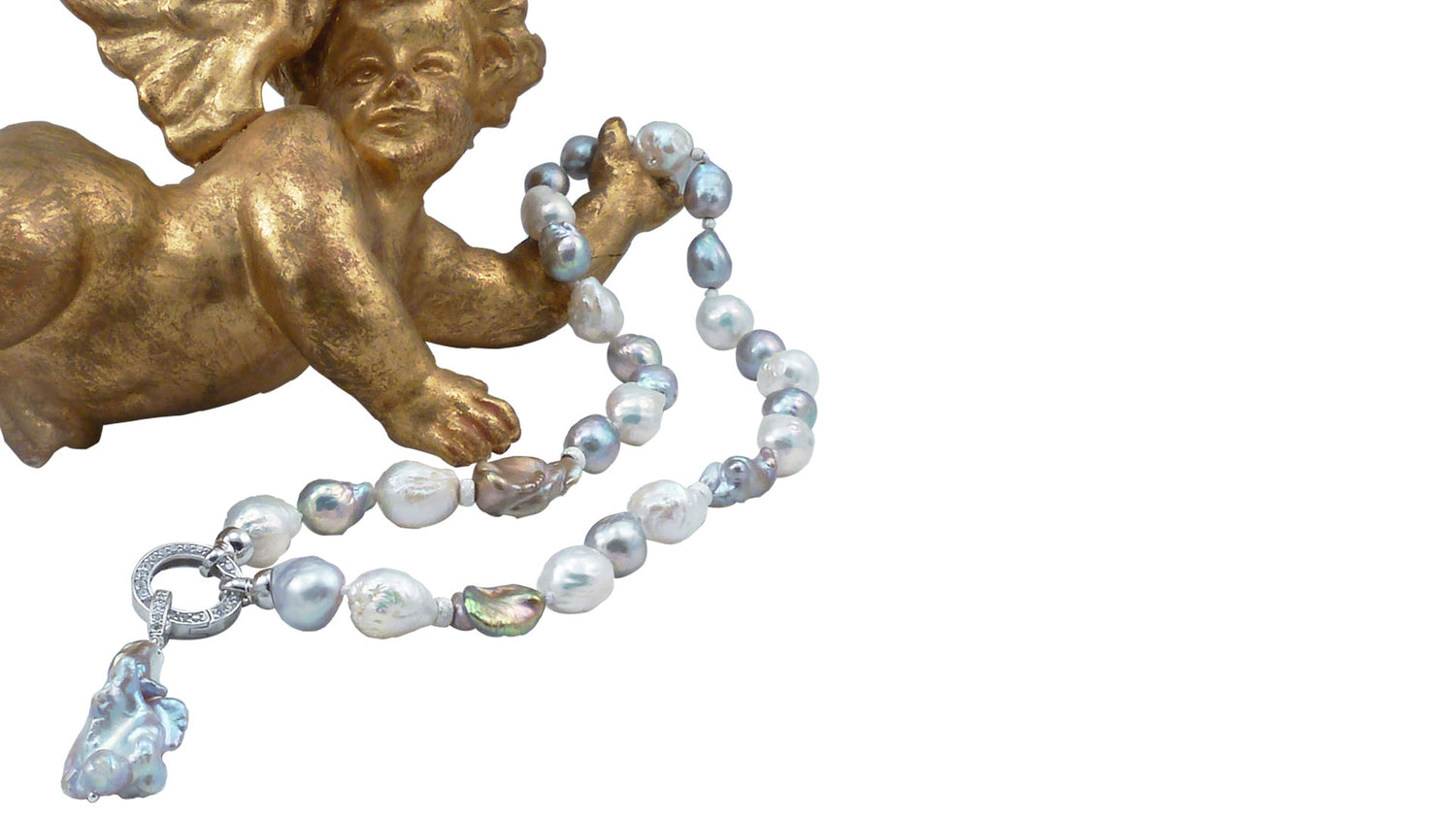 One-of-a-kind_pearl_jewelry_is_always_a_perfect_meaningful_jewelry_gift._Unique_freshwater_pearl_necklace_features_highly_lustrous_baroque_pearls_of_various_colors._Jewelry_Olga_Montreal_Canada