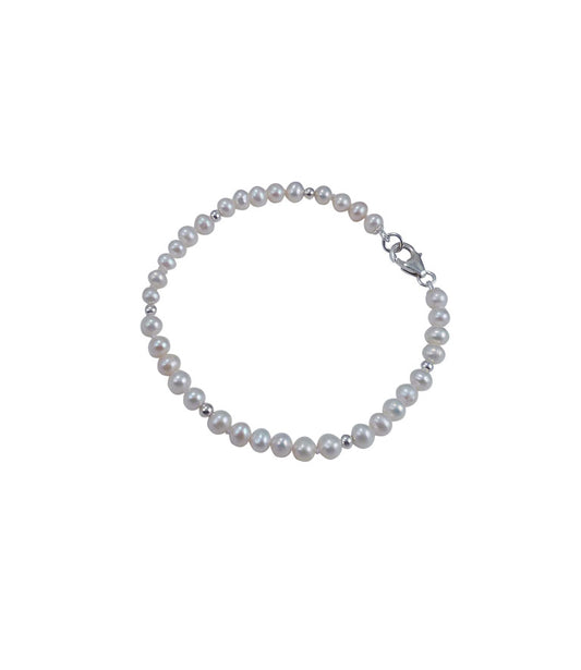 Small white pearl bracelet featuring real freshwater pearls.  Wear this contemporary pearl jewelry alone or share it with other pearl bracelets