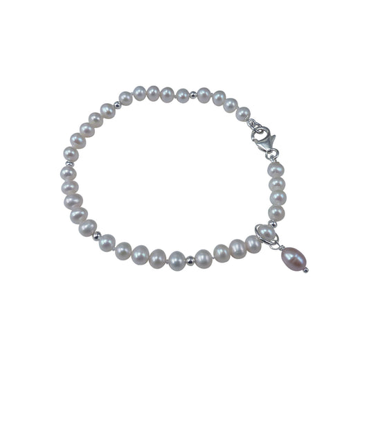 Small white pearl bracelet with a pearl charm.  Stylish contemporary pearl jewelry.