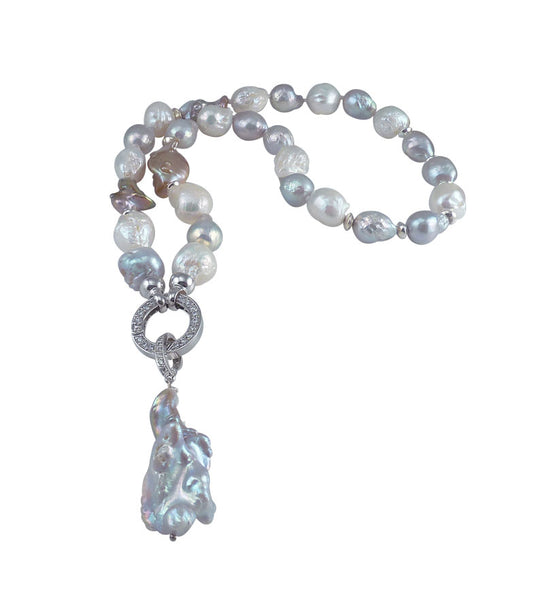 Statement baroque pearl necklace featuring freshwater pearls of various shapes, colors, and textlures.  Custom pearl jewelry