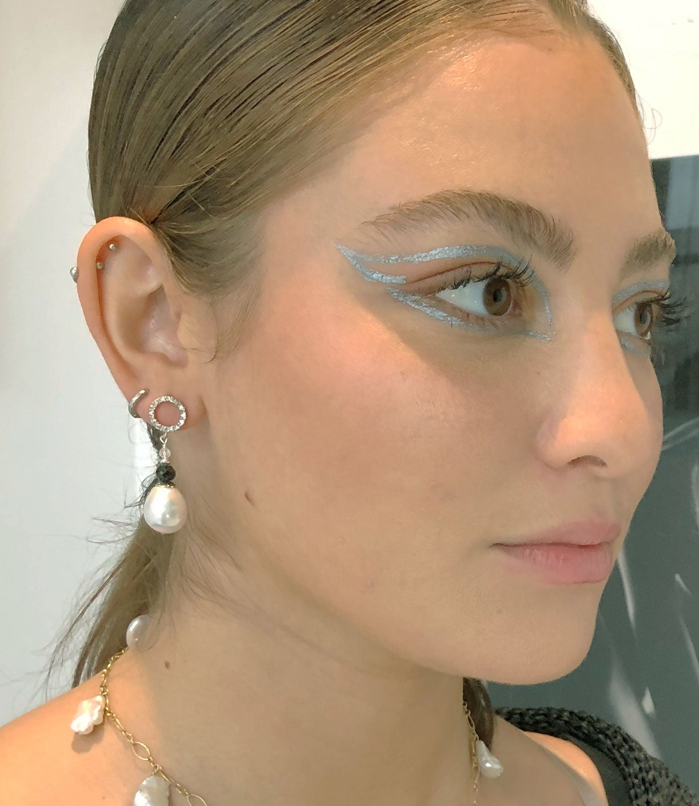 Stunning custom white pearl earrings featuring freshwater white pearls featured with black spinel and rock quartz.  Amazing fashion accessory for a stylish woman