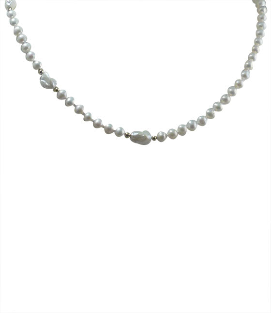 Trendy pearl choker necklace for fashion-forward women.  Modern pearl jewelry.  White pearl jewelry is a must