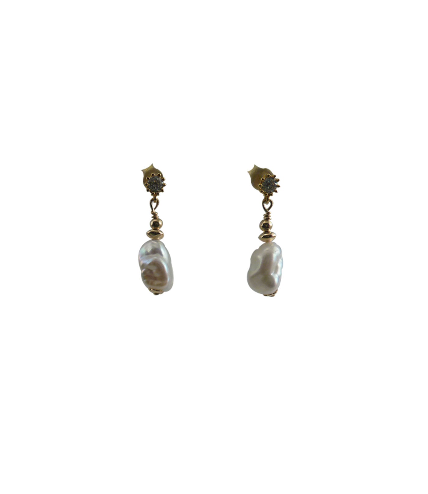 Modern white pearl earrings featuring lustrous freshwater keshi pearls. Contemporary pearl jewelry for everyday wearing or graduation gift.
