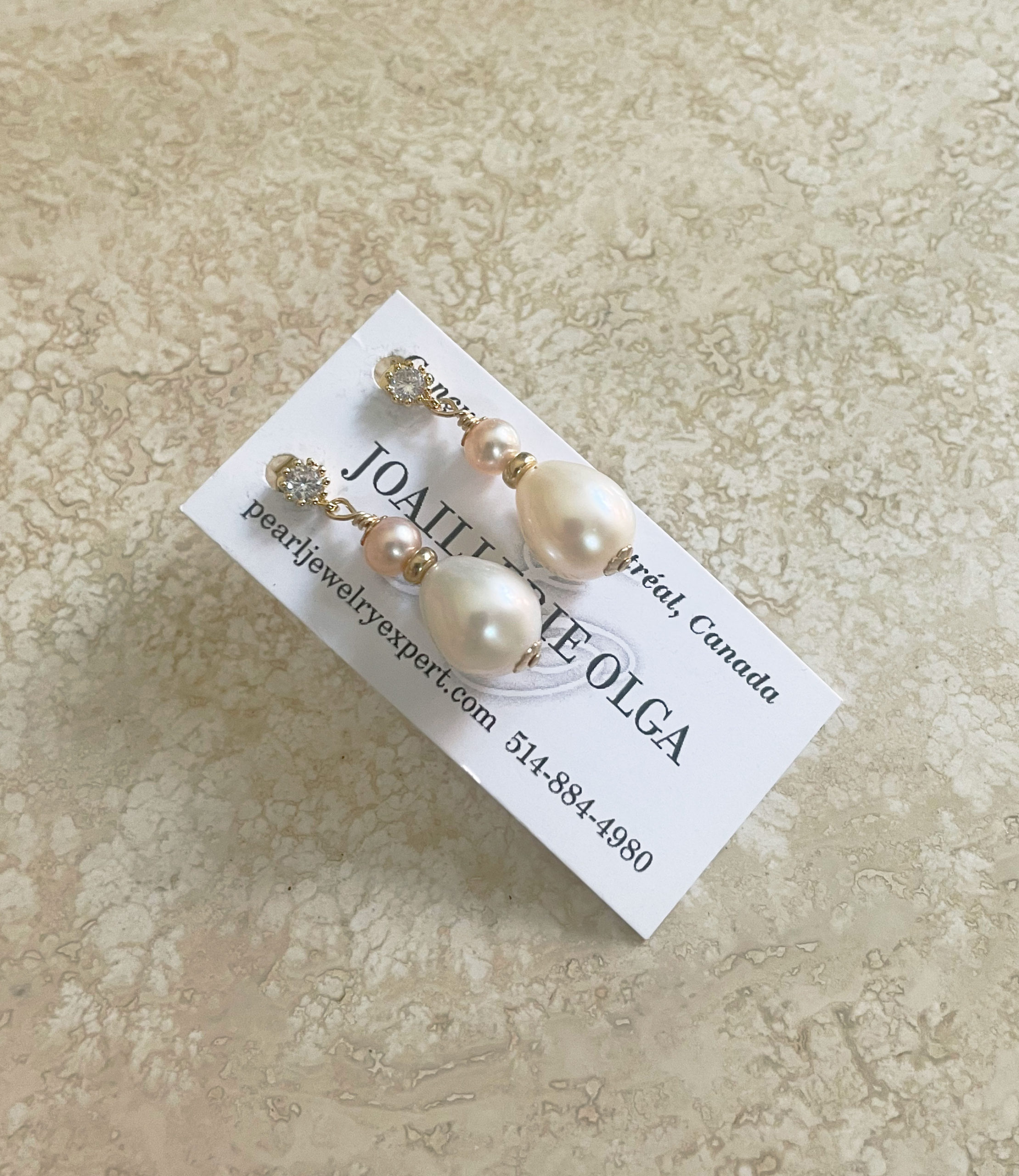 Dainty white pearl earrings feature freshwater pearls. Designed and created by Jewelry Olga Monteal Canada